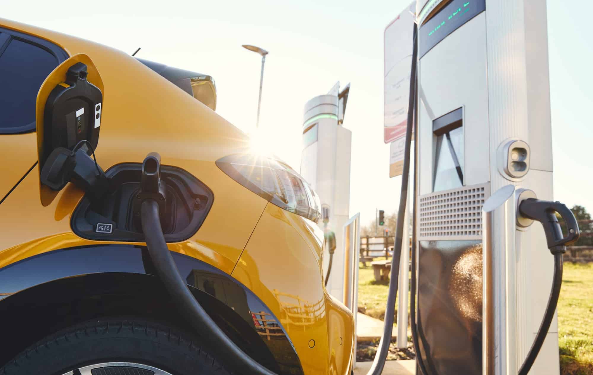 EV charging stations Plugged in electric car