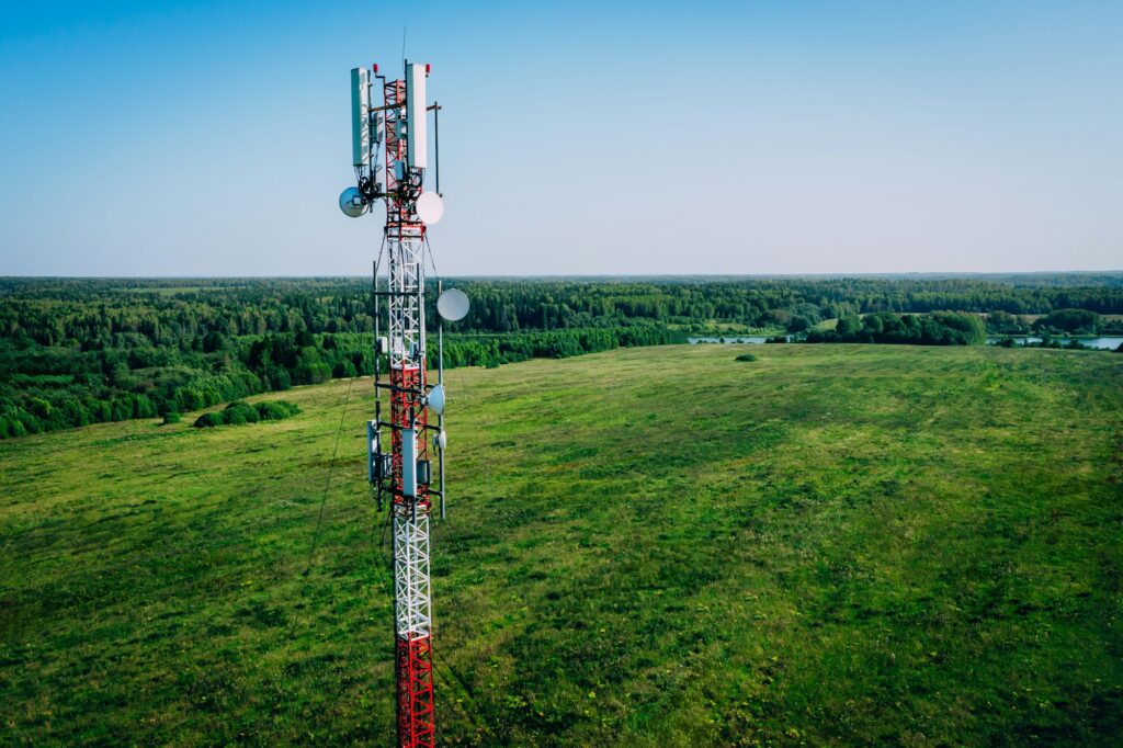 Aerial drone view of 5G telecommunication tower. GSM and radio telecommunication tower.