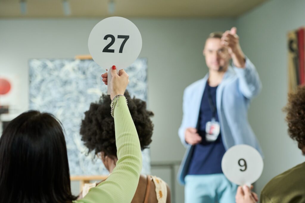 Young woman taking part in bidding